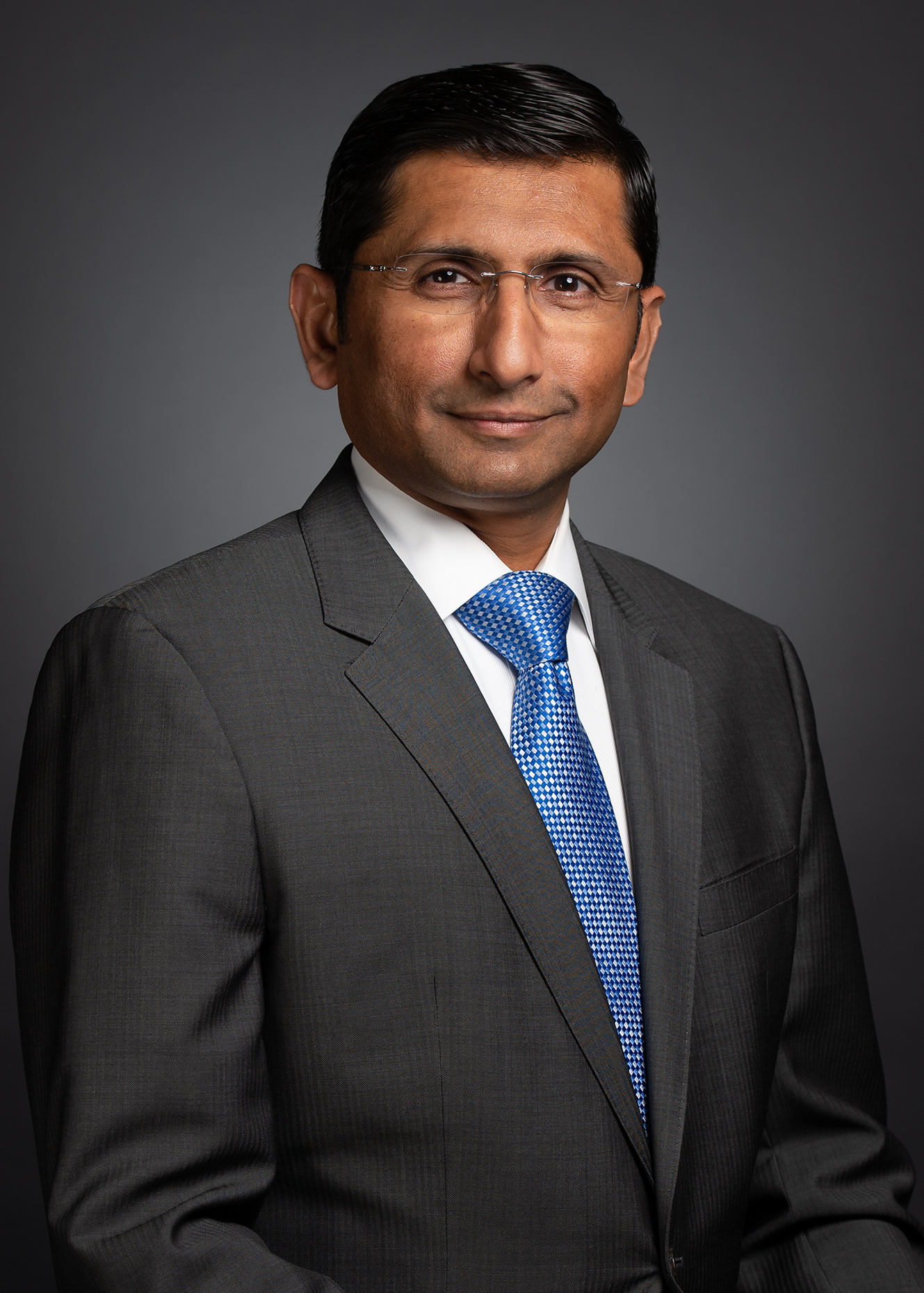 man with dark skin with eye glasses in suit corporate headshot on location photography JPVisual Los-Angeles